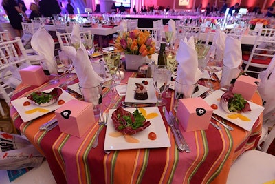 The tier-two sponsors who purchased $6,000 tables had brightly colored striped linens to differentiate their tables from others in the ballroom.