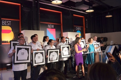 The 2014 class of Food & Wine's Best New Chefs posed on stage at the event with the magazine's editor in chief, Dana Cowin, and publisher Christina Grdovic.