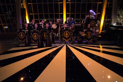 Vince Giordano and the Nighthawks, an 11-piece band, performed on a custom black-and-white sunburst Lucite dance floor from HiTech Events.