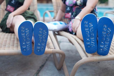 At the opening party for Delta Air Lines Global Sales Conference in 2011, American Express provided white flip-flops marked with its blue logo. As the 850 guests made their way through the party set up around the Walt Disney World Swan and Dolphin’s pool and beach, the sandals left imprints of the brand's name in the sand.