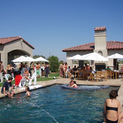Guests lounged around a vast pool at a private mansion for the Motorola and DKNY Jeans pool party.