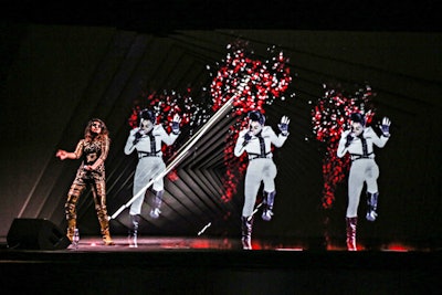 In New York, rapper M.I.A. (pictured, far left) was joined on stage by a holographic Janelle Monaé. A portal-like backdrop illuminated by animated graphics added a depth-of-field to the visuals.