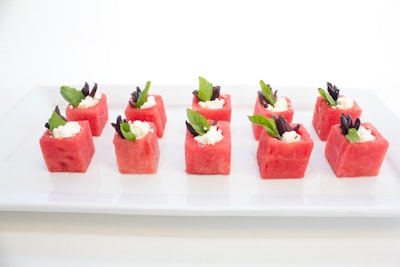 Watermelon cups filled with kalamata olives, feta, and basil, by Word of Mouth Catering in Austin, Texas
