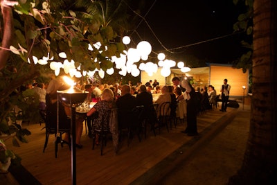 For the Louis Vuitton Charlotte Perriand V.I.P. dinner during Art Basel last year, the luxury brand set up an alfresco table right on the beach. The event had a chic, minimalist look with glowing orbs hanging overhead.