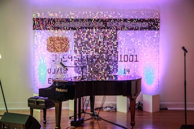 Artist Dana Kase designed a custom American Express EveryDay card made from paillettes. The piece acted as the backdrop for the stage where singer-songwriter duo A Great Big World performed several songs, including its hit “Say Something.”
