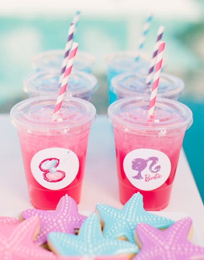 Pink punch and paper straws, as well as starfish-shaped cookies, made for colorful treats at the Barbie: The Pearl Princess-inspired party.