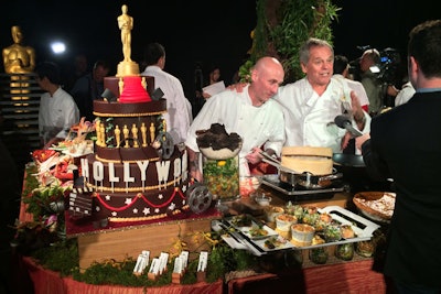At this year's Governors Ball, hosted by the Academy of Motion Picture Arts and Sciences on Oscar night, Wolfgang Puck created a Hollywood-theme cake that celebrated 20 years of Puck's involvement with the bash. It was meant to recall the on-theme look of a zoetrope and included a motorized moving tier that spun around, as well as several other Hollywood-inspired decorative details.