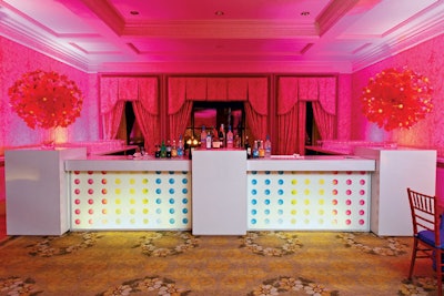 A bat mitzvah designed by Boston-based Rafanelli Events incorporated a Willy Wonka theme and a cocktail bar cleverly constructed to resemble candy buttons. Chicka Event Production provided the custom bar.