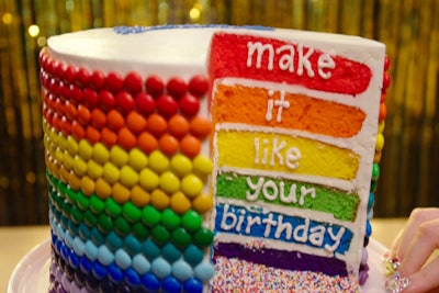 Another cake created for the 'Birthday' video included a six-layer treat covered in rainbow candies. Each inside layer was stacked in rainbow order, from red to purple.