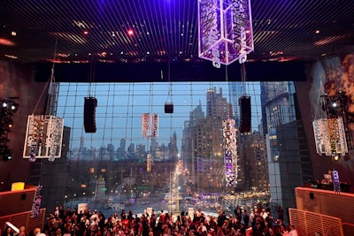Organizers took advantage of the soaring ceilings at Frederick P. Rose Hall at Jazz at Lincoln Center, drawing the eyes upward with custom chandeliers, video projections, and activations on every level of the tiered room.