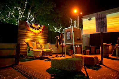 A custom photo studio encouraged guests to put on vintage cowboy hats and vests, then pose seated on ranch-style cowhide chairs.