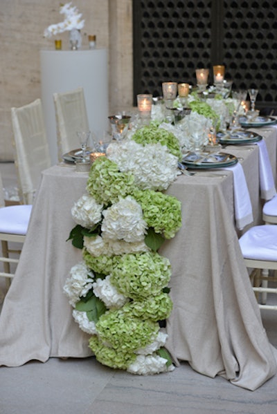 Debi Lilly of A Perfect Event decked her reception table with a long runner of green and white hydrangeas. The table had a gentle, flowery fragrance surrounding it.