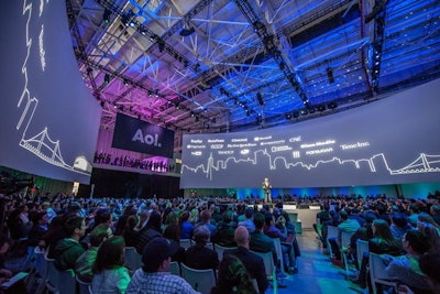 The relatively simple stage and seating setup was designed to make the screens and content displayed the focal point of the presentation.