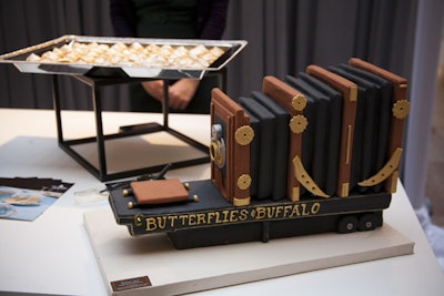 Tipsycake showcased its meticulously detailed cakes, including one shaped like the enormous camera 'Butterflies & Buffalo' (pictured). At its station, Vanille Patisserie offered more sweets, including miniature red velvet cupcakes topped with heart-shaped confetti.