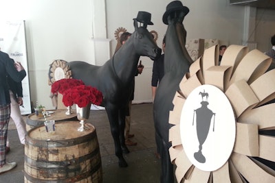New York restaurant Tipsy Parson hosts an annual Kentucky Derby party, and in 2013 the outing at Drive In Studios had plenty of quirky details from Matthew Robbins Design and Gifts for the Good Life. Two horse-shaped props stood at the entrance to the event, decorated with black hats and oversize award ribbons.