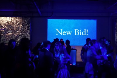 The projection wall was used to display a live feed of the silent auction, showing the items and their current bids as well as flashing bright purple whenever a new bid was made.