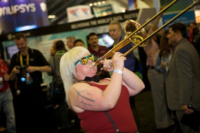 The flamboyant Extra Action Marching Band provided a raucous start to the opening-night reception in the World of Solutions.