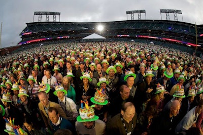For the closing-night concert at AT&T Park with Lenny Kravitz and Imagine Dragons, attendees donned hats that looked like birthday cakes in honor of the event's 25th anniversary. Each year, organizers create a signature hat that is unveiled on the final night.