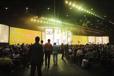 Prior to each of the four global sessions, screens in the front of the room displayed feeds from external social networks such as Twitter and Facebook.