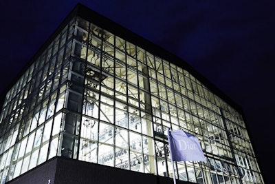 Dior branded the arrivals dock as well as the side of the Duggal Greenhouse with simple grey flags in the house's signature color.