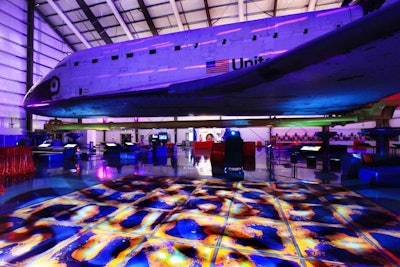 The after-party had many volcano-inspired details, like a dance floor designed to mimic lava flow and a screen with projected images of volcanic activity from space.