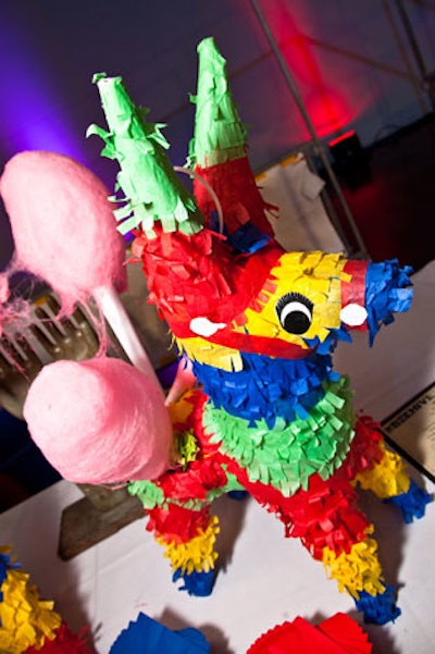 The piñatas at the Room to Dream Gala in Boston served a practical function by holding individual servings of cotton candy. The 2010 event had a carnival theme.