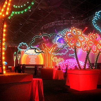 For the Robin Hood Foundation's annual benefit, Avi Adler filled the cocktail area with giant potted flowers, trees and clouds made of wood and lined with light bulbs.