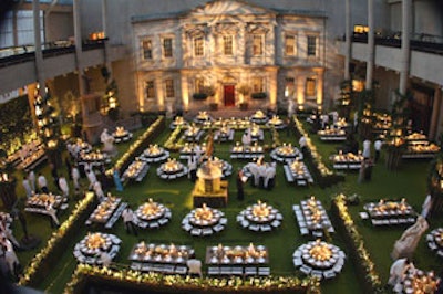 Designer David Monn used 400 feet of espalier apple trees to create a winding hedge in the Metropolitan Museum's Englehard Court, separating the 75 tables into mini-gardens.