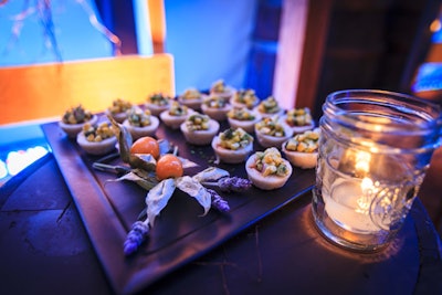 Candles in jam jars decorated trays of appetizers; Limelight provided the catering. Dinner was gem lettuce and charred-vegetable succotash followed by pistachio-crusted beef tenderloin and coconut-shortbread-lemon-curd tarts with Rainier cherries.