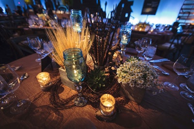 Centerpieces had wheat, decorative feathers, and votive candles in mercury glass. Hall's provided the rentals, and BBJ provided linens.