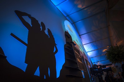 Silhouettes depicting scenes from past Steppenwolf productions gave the appearance of mountain ranges in the prairie-theme tent.