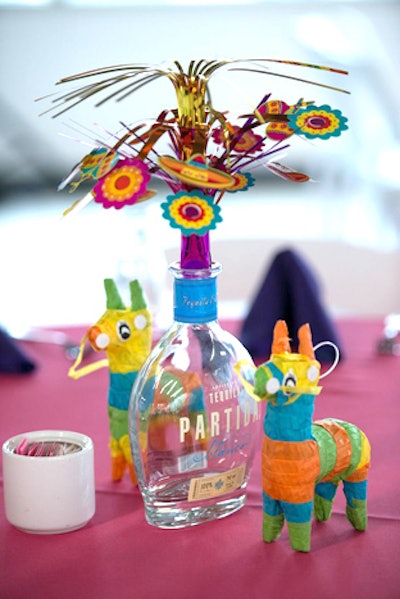 Tables were decked with mini piñatas and tequila bottles holding colorful paper flowers.