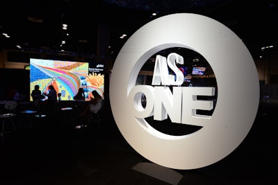 A large 3-D representation of the convention’s “As One” logo served as a backdrop for photos in the Engagement Center.
