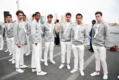 Upon arrival at the Brooklyn Navy Yard, guests disembarked from the branded Dior ferry and were met by a phalanx of handsome male models dressed in Dior sailor uniforms. While one group assisted and escorted guests off the dock and onto land, another was armed with seemingly never-ending flutes of champagne as well as glasses of water and orange juice.