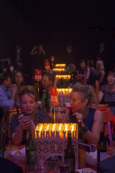 Centerpieces were designed as bridge-like structures with 'thank you' spelled out on four sides.