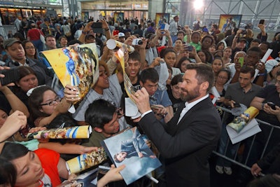 Fans camped outside the convention center overnight for the chance to be one of 1,500 people allowed into the event. The first 500 were invited to a dedicated section of the red carpet. The other 1,000 were given space in the venue's main hall, which offered them views of the arrivals via a Jumbotron, access to talent like Hugh Jackman, and commemorative posters and T-shirts for cast to sign.