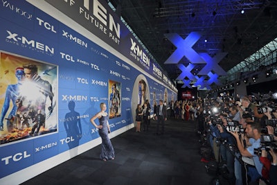 A custom backlit wall served as the backdrop for the red carpet, and large Xs overhead added depth. The wall itself measured more than 180 feet long and 20 feet tall.