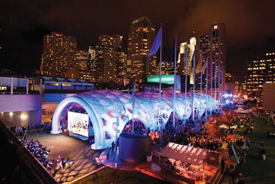 A huge inflatable tent provided shelter at Dreamforce Plaza, the event’s outdoor venue constructed between two buildings of the Moscone Center in San Francisco. Inside the tent, organizers created networking lounges and a community service activity benefiting local hospitals.