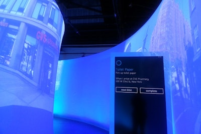 Microsoft also wanted to showcase Cortana's location-based ability, which was challenging given that guests were in one fixed place. The event team used projections to help simulate what users might experience. That included images of the nearest CVS to help illustrate answers to the question, 'You dash into a drug store on your way home from work. What do you always forget?' Names were also programmed into the R.F.I.D.s, allowing the stations to recognize which attendee was interacting with it at any given time.