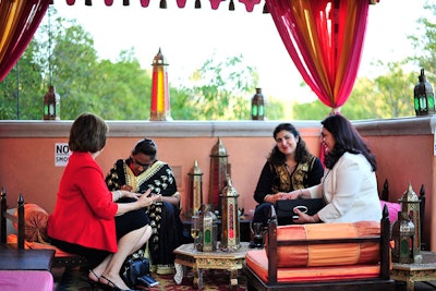 Guests sat under a colorful tent for temporary henna tattoos.