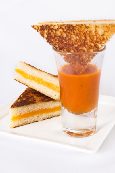 Mini grilled cheese sandwiches, paired with creamy tomato bisque, by Puff ’n Stuff in Orlando