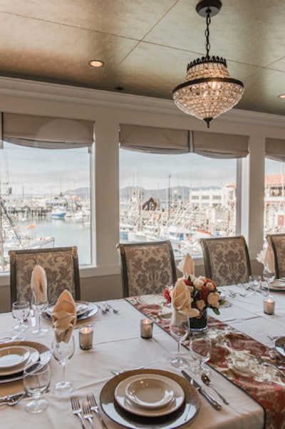 Alioto’s Restaurant in Fisherman’s Wharf renovated its banquet rooms in October. The Harbor Room, which seats 55 guests, has large windows with views of the Golden Gate Bridge and San Francisco Bay. The room includes a private bar and is equipped with an audiovisual system, television, and projection screen, making it appropriate for business presentations. The Bridge Room seats 18 guests and includes design features such as antique crystal lighting, granite-top buffets, and bronze leather ceiling tiles; a window frames views of the water.