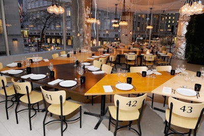 Instead of hosting a show at the Mercedes-Benz Fashion Week tents in 2011, Lacoste hosted a dinner for 40 at its Fifth Avenue store. The Manhattan space was under construction, so the apparel brand dressed it up with a stained and varnished plywood table under the exposed ceilings and wires, and marked chairs simply with numbers instead of place cards.