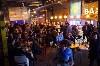 For attendees who wanted to skip the main stage talks—or couldn't find a seat—there was the Garage, a more casual venue with a vintage design aesthetic. The space showed live feeds of what was happening on the main stage but also offered its own programming, such as smaller presentations, business pitches, musical acts, and a bar and grill.