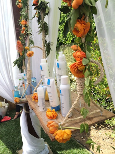 Beauty products intended for morning use sat atop a flower-adorned swing at the 'Rise and Shine' station.