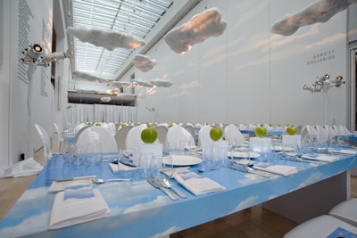 Images of blue skies decked the tabletops, and green apples sat atop Lucite boxes that glowed after the sun set.