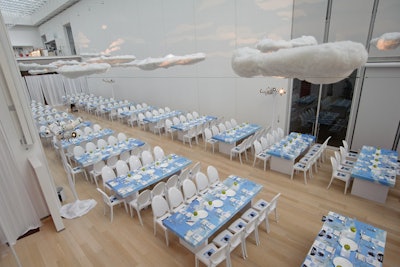 Drawing from another emblem in Magritte's work, HMR Designs hung 45 floating clouds in the dinner space.