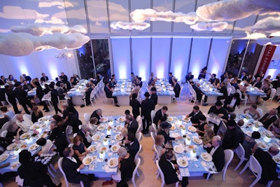 Frost handled the lighting and created cloud-filled projections to go with the floating clouds above the dinner tables.