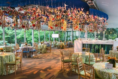 A chandelier contained 1,000 colorful origami paper cranes, a symbol of good luck in Japan. The ball's invitation came in an origami envelope, and planners sought to tie it into the decor.