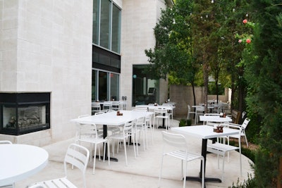 Located in a two-story house on Rainey Street, NO VA Kitchen & Bar opened last August and has several options for private entertaining. Indoors is the main dining room for 50 guests and a 14-seat private dining room with audiovisual equipment. A patio with a dual-sided fireplace seats 50, and a covered balcony seats 25. The restaurant has a curated menu of items such as pear pecan salad, whipped blue cheese, and beer-braised pork shank.